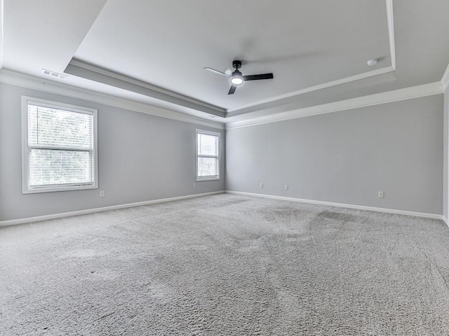 212 Torch Dr, Acworth, GA 30102 - carpeted empty room featuring a tray ceiling, ornamental molding, and a ceiling fan
