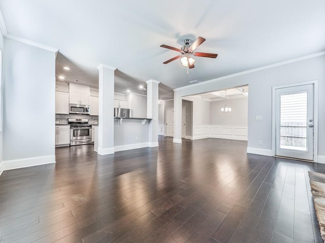 212 Torch Dr, Acworth, GA 30102 - unfurnished living room with ornamental molding, a ceiling fan, dark wood-type flooring, recessed lighting, and a chandelier