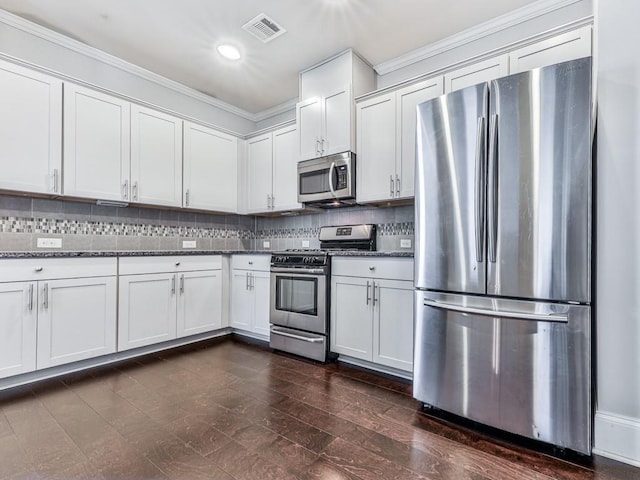 212 Torch Dr, Acworth, GA 30102 - kitchen with stainless steel appliances, crown molding, backsplash, white cabinetry, and recessed lighting