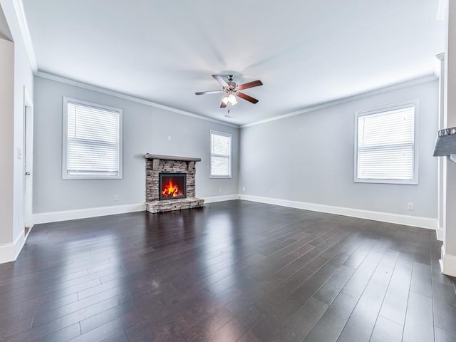 212 Torch Dr, Acworth, GA 30102 - unfurnished living room with ornamental molding, a stone fireplace, ceiling fan, and dark wood-type flooring