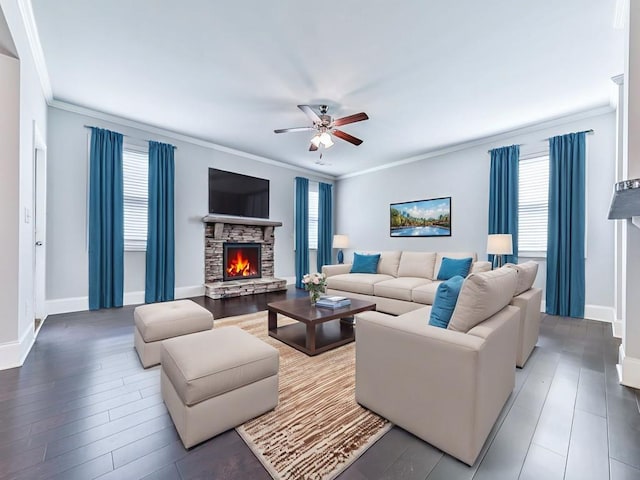 212 Torch Dr, Acworth, GA 30102 - living area featuring crown molding, a ceiling fan, a stone fireplace, and wood finished floors