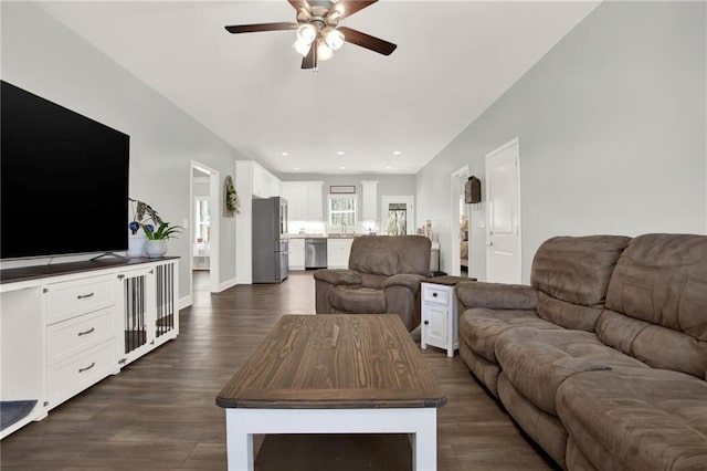 living area with recessed lighting, dark wood finished floors, baseboards, and ceiling fan