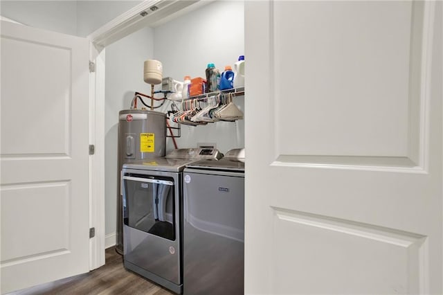 laundry area featuring laundry area, dark wood-type flooring, and washer and dryer