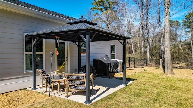 view of patio / terrace with fence and a gazebo