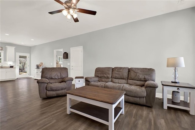 living area with baseboards, dark wood finished floors, a ceiling fan, and recessed lighting