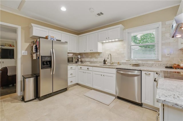 3110 Springdale Park Cir, Gainesville, GA 30506 - kitchen with stainless steel appliances, a sink, white cabinetry, decorative backsplash, and ornamental molding
