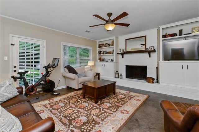 3110 Springdale Park Cir, Gainesville, GA 30506 - living area featuring a ceiling fan, built in shelves, a brick fireplace, crown molding, and baseboards