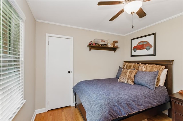 3110 Springdale Park Cir, Gainesville, GA 30506 - bedroom with light wood-style flooring, crown molding, ceiling fan, and baseboards