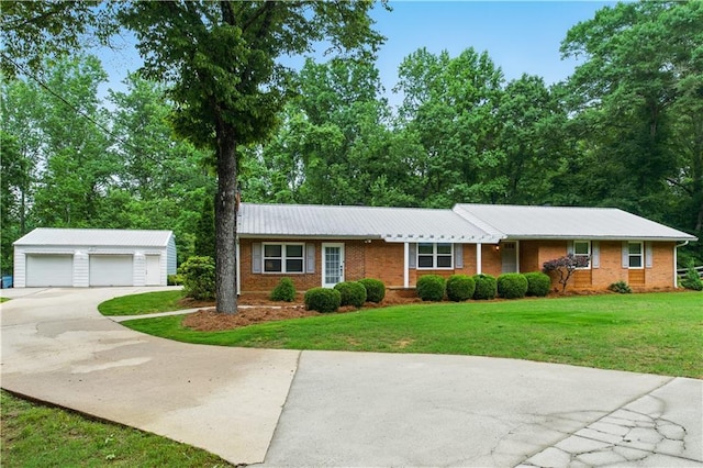 3110 Springdale Park Cir, Gainesville, GA 30506 - single story home with an outbuilding, a detached garage, a front yard, and brick siding