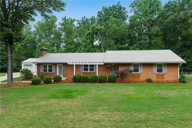 3110 Springdale Park Cir, Gainesville, GA 30506 - ranch-style home featuring an attached garage, a chimney, a front yard, brick siding, and metal roof