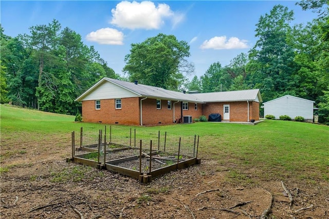 3110 Springdale Park Cir, Gainesville, GA 30506 - rear view of house featuring a garden, central AC, a lawn, and brick siding