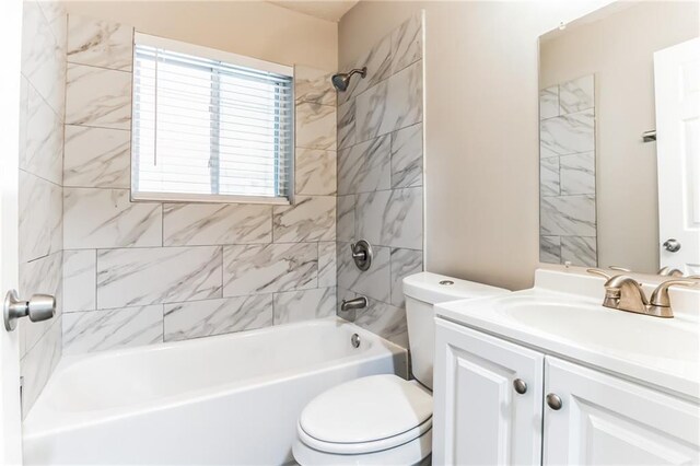 full bathroom with vanity, toilet, and tiled shower / bath