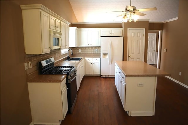 kitchen featuring backsplash, a center island, dark wood finished floors, white appliances, and a sink