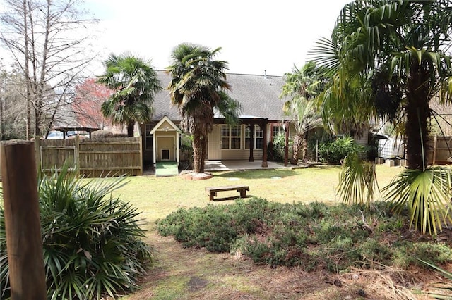 view of yard featuring a patio and fence