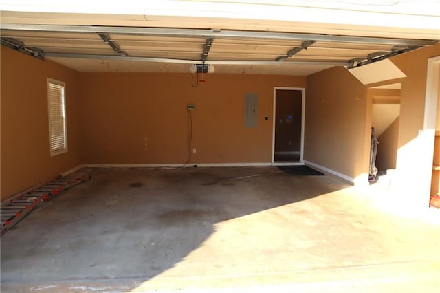 garage with electric panel and a garage door opener