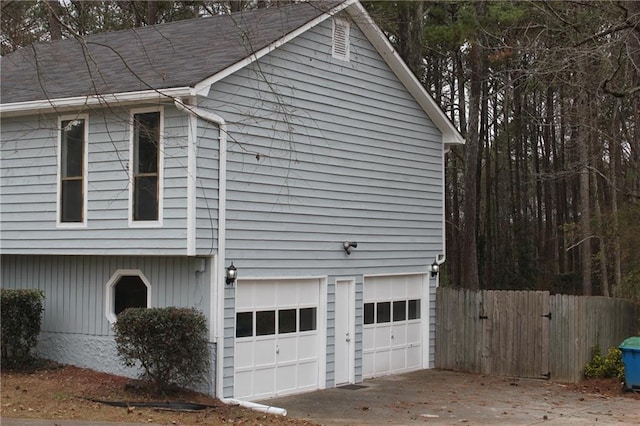 view of property exterior featuring a garage