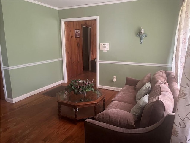 living room with dark hardwood / wood-style floors and ornamental molding