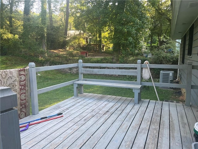 wooden deck featuring a yard