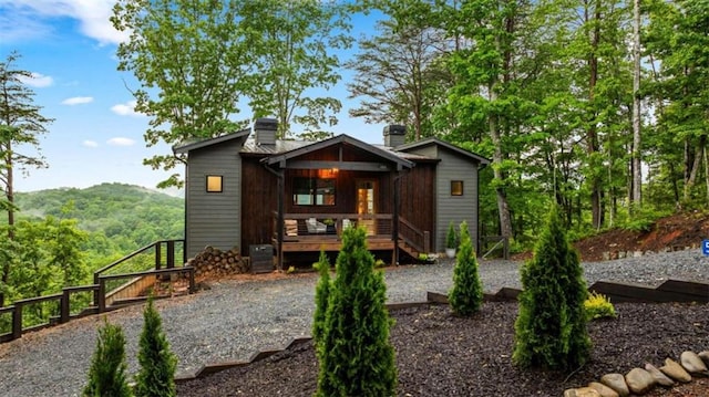 back of property featuring a mountain view