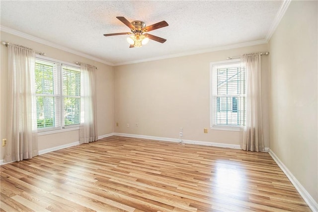 205 Peachtree Forest Ter, Peachtree Corners, GA 30092 - spare room featuring a textured ceiling, light wood-style flooring, a ceiling fan, and ornamental molding