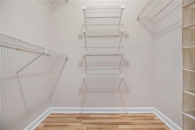 205 Peachtree Forest Ter, Peachtree Corners, GA 30092 - spacious closet featuring wood finished floors