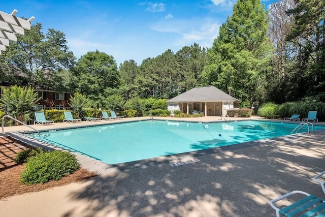 205 Peachtree Forest Ter, Peachtree Corners, GA 30092 - community pool with a patio and view of wooded area