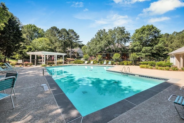 205 Peachtree Forest Ter, Peachtree Corners, GA 30092 - community pool with a pergola, a patio area, and view of wooded area