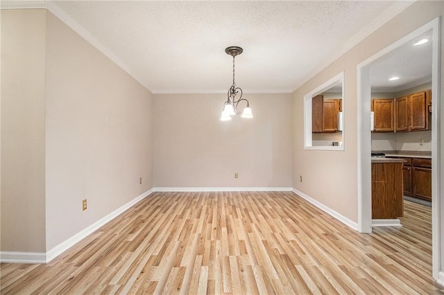 205 Peachtree Forest Ter, Peachtree Corners, GA 30092 - unfurnished dining area featuring light wood-style flooring, ornamental molding, a chandelier, and a textured ceiling
