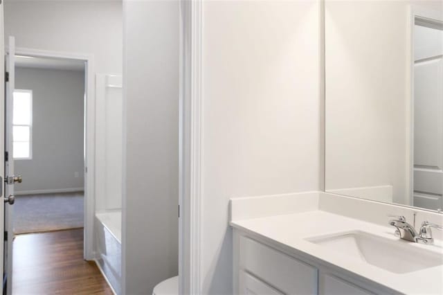 bathroom featuring vanity and hardwood / wood-style floors