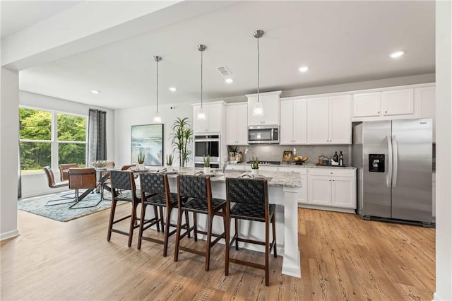 living room with light hardwood / wood-style floors