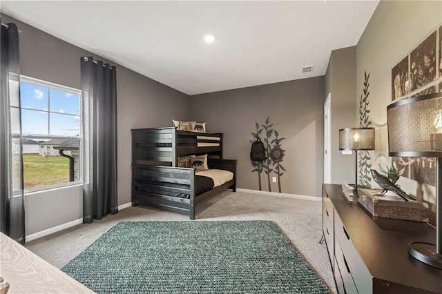 carpeted bedroom featuring ensuite bathroom