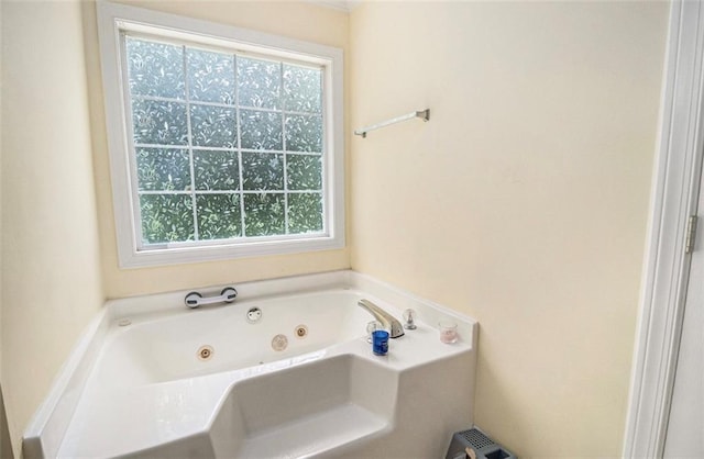3514 Blackberry Ln SE, Conyers, GA 30094 - bathroom featuring healthy amount of natural light and a jetted tub