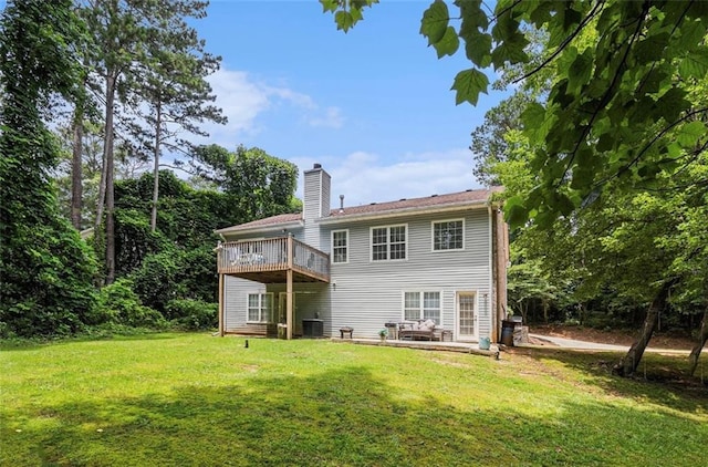 3514 Blackberry Ln SE, Conyers, GA 30094 - back of house with a lawn, a chimney, and a deck