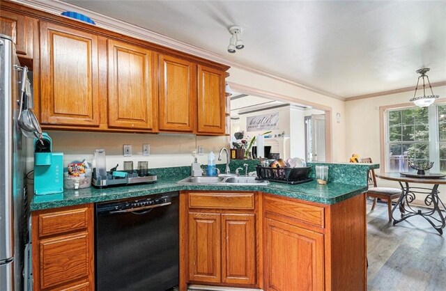 3514 Blackberry Ln SE, Conyers, GA 30094 - kitchen featuring black dishwasher, brown cabinetry, dark countertops, ornamental molding, and a peninsula
