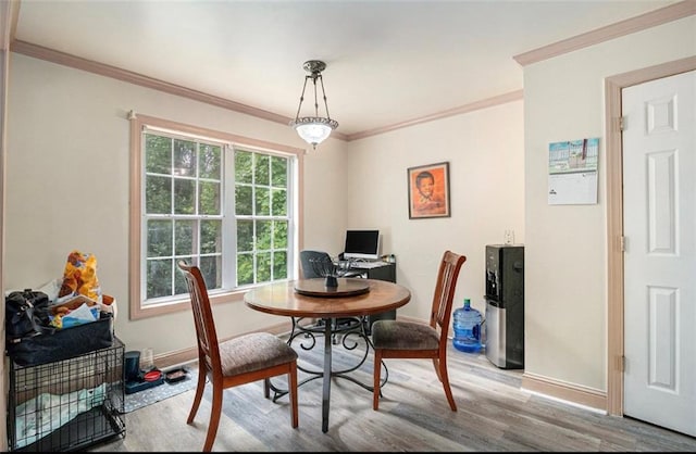 3514 Blackberry Ln SE, Conyers, GA 30094 - dining space featuring wood finished floors and ornamental molding