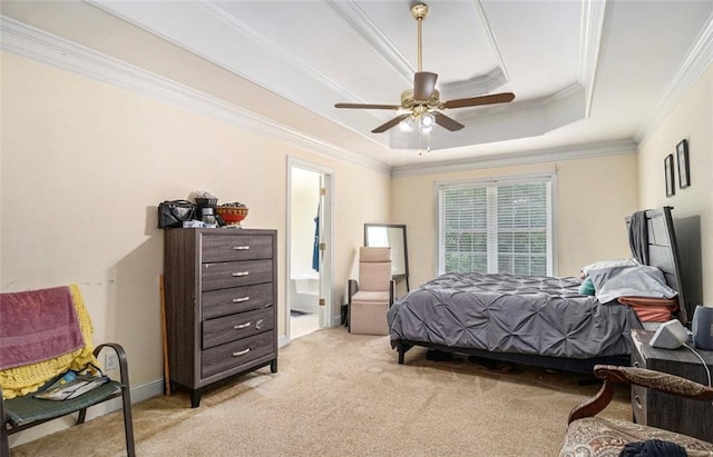 3514 Blackberry Ln SE, Conyers, GA 30094 - bedroom featuring a tray ceiling, light carpet, ornamental molding, a ceiling fan, and connected bathroom