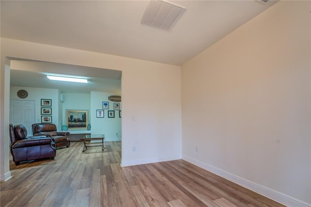 unfurnished room with light hardwood / wood-style floors