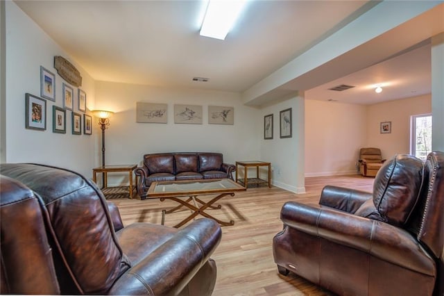 living room with light hardwood / wood-style floors