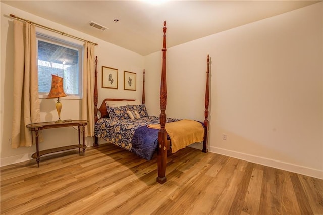 bedroom with light hardwood / wood-style flooring