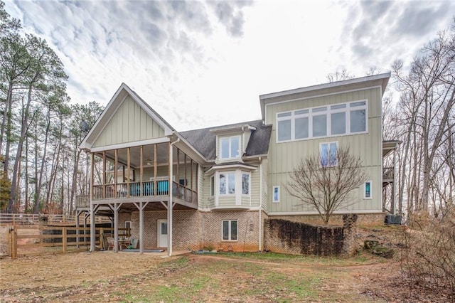 rear view of property featuring central AC unit