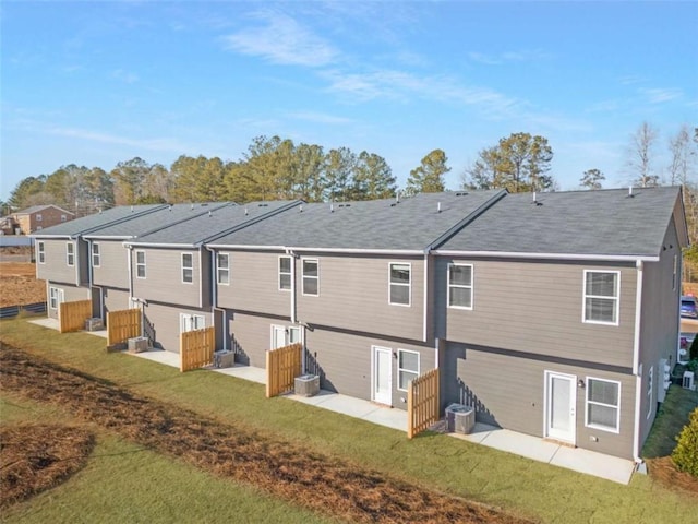 227 Ivey Ter Unit 36, Temple, GA 30179 - rear view of property with a patio area, a lawn, and roof with shingles