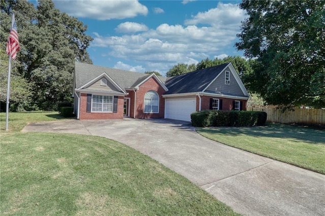 single story home featuring a garage and a front yard