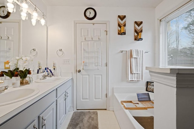 bathroom featuring vanity and a washtub