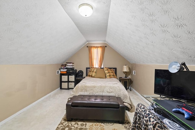 carpeted bedroom featuring lofted ceiling and a textured ceiling