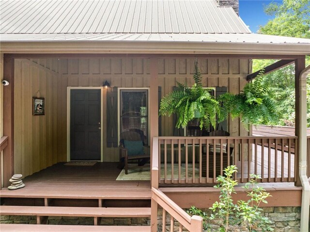 85 Misty Hollow Rdg, Ellijay, GA 30536 - property entrance featuring a deck, a chimney, and a metal roof