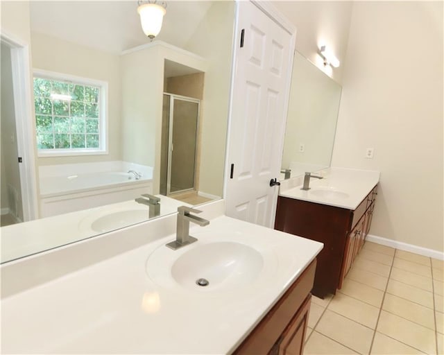 bathroom featuring vanity, tile patterned floors, and plus walk in shower