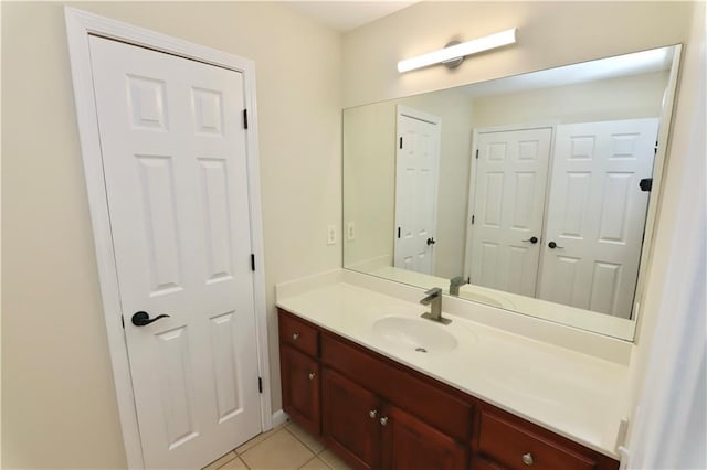 bathroom with tile patterned floors and vanity