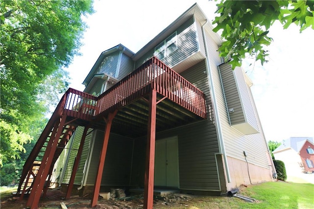 back of house featuring a deck