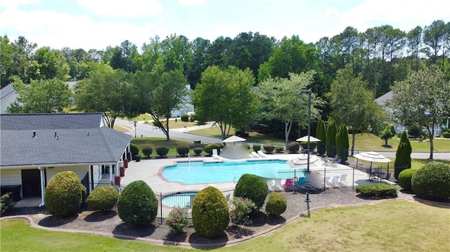 view of swimming pool featuring a patio area and a lawn