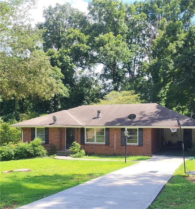 ranch-style house with a front yard and a carport